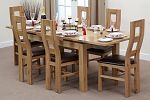 4ft 7" x 3ft Solid Oak Extending Dining Table + 6 Brown Wave Back Chairs