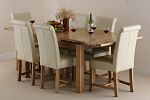 4ft 7" x 3ft Solid Oak Extending Dining Table + 6 Cream Leather Braced Scroll Back Chairs