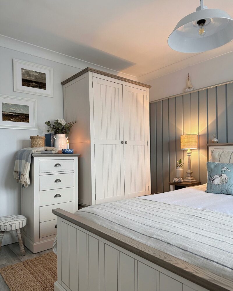 Oak Furnitureland coastal-inspired bedroom with white painted farmhouse-style Brompton furniture.