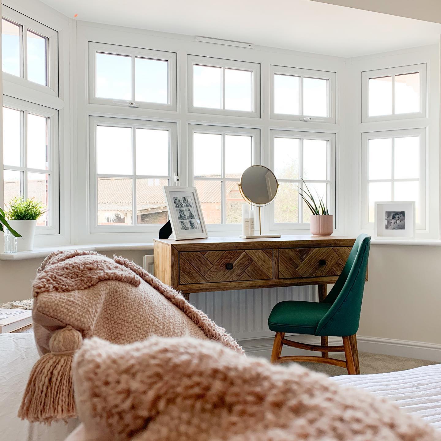 Oak Furnitureland Parquet console table used as a dressing table in a bedroom.