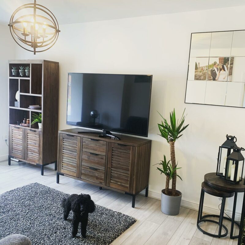 Living room styled with contemporary dark Detroit range including a bookcase, sideboard and nest of tables.