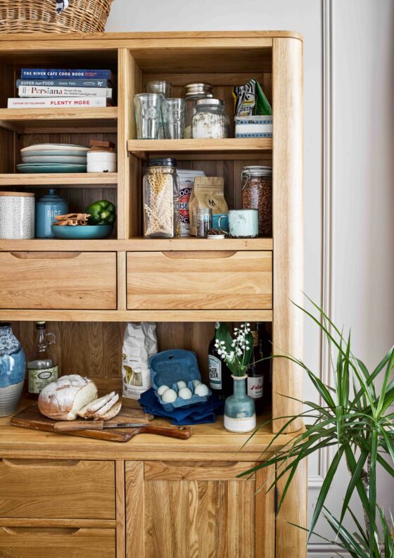 Romsey dresser filled with glass jars, recipe books and decorative objects.