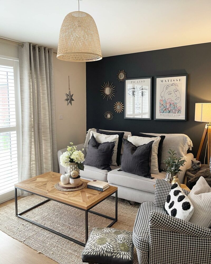 Oak Furnitureland grey Jasmine sofa with grey and white cushions in monochrome living room.