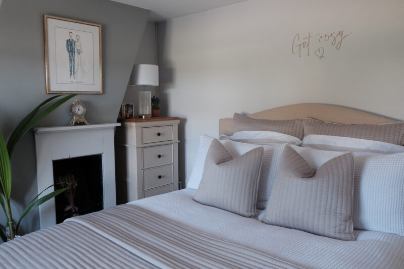 Shay grey painted tallboy in an elegant grey and neutral bedroom. 