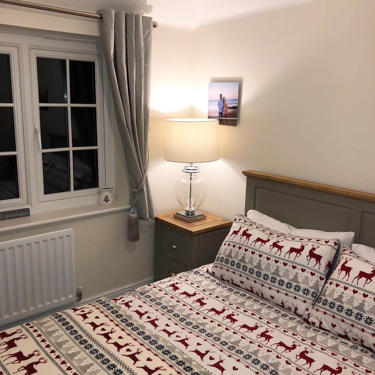 St. Ives grey painted bed styled with festive chalet-style bedding.