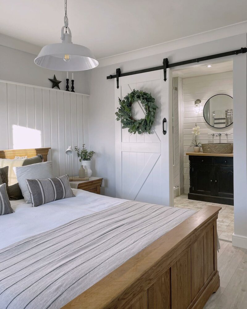 Rustic and elegant white bedroom featuring Oak Furnitureland French Farmhouse oak bed.
