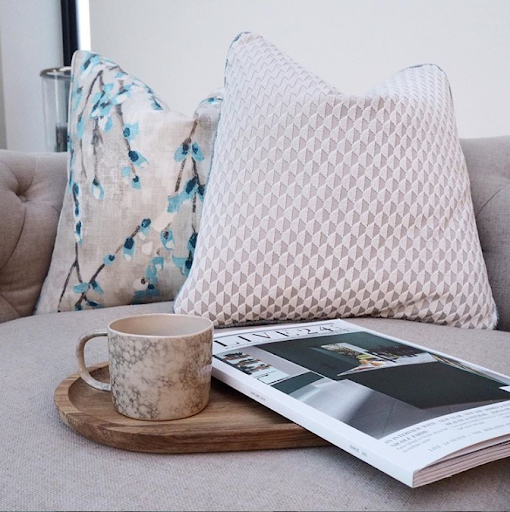 blush toned cushion wiith magazine