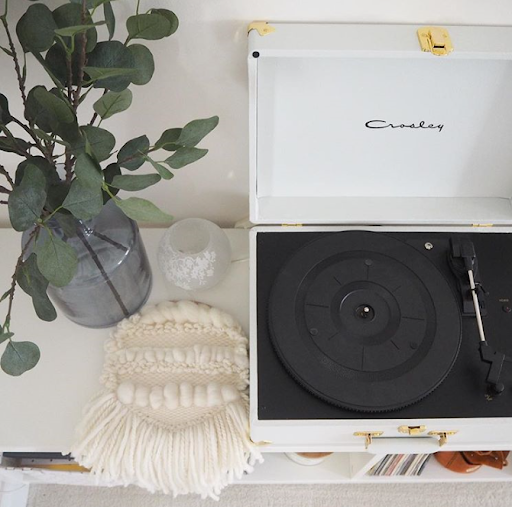 crosley record player with plant