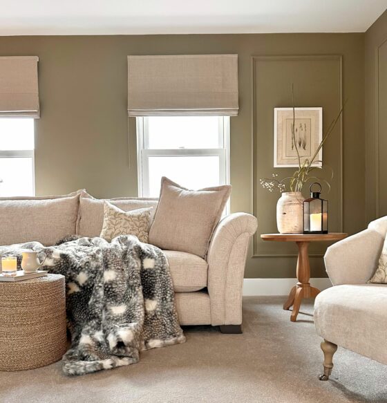 Oak Furntureland Ashby sofa in neutral living room with pale green walls, cosy accessories and neutral details.