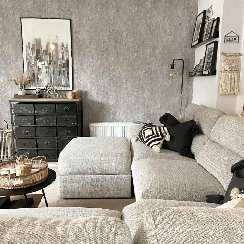 Monochrome living room with a cosy Oak Furnitureland Morgan corner sofa in grey upholstery with tactile cushions.
