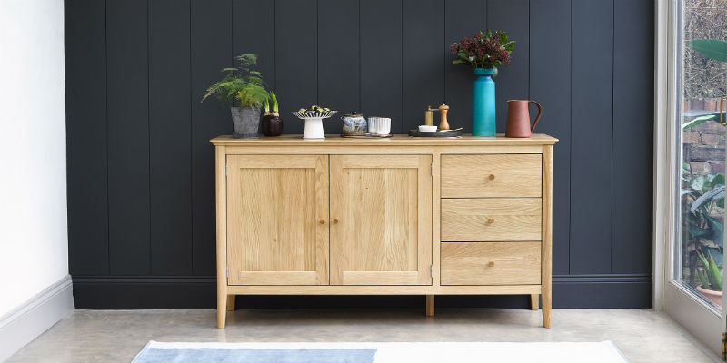 scandinavian style sideboard with house plants on top