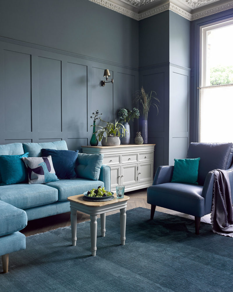 Blue themed living room with grey painted furniture