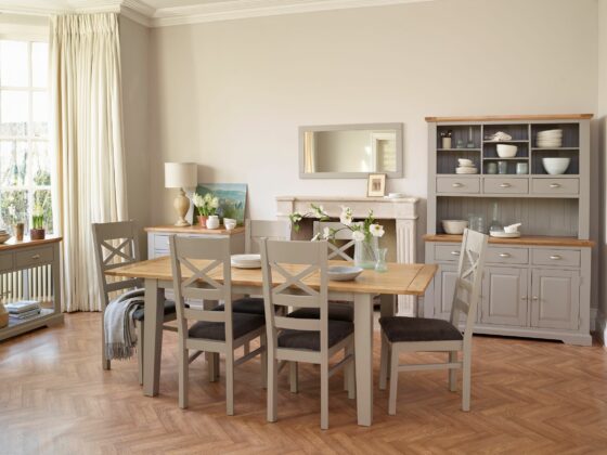 St. Ives grey painted dining table with matching dresser in a dining room.