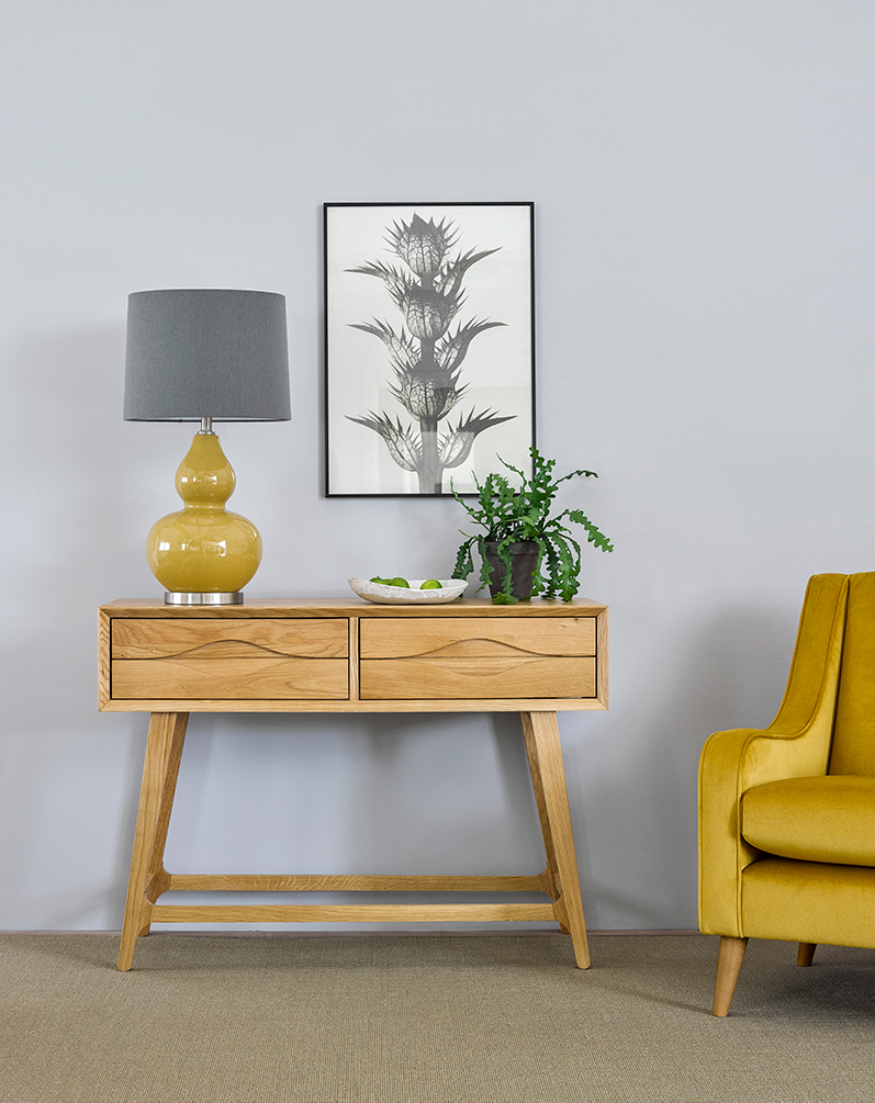 Scandinavian style console with yellow and grey accessories
