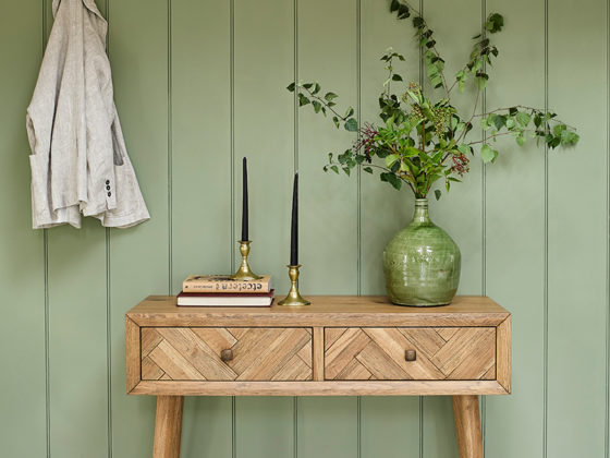 retro style console table with green plants
