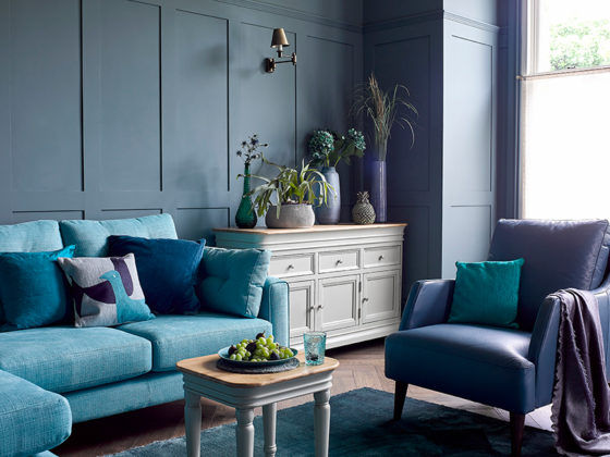 Blue themed living room with grey painted furniture