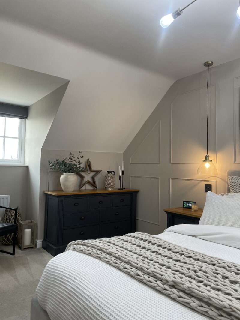 Oak Furnitureland Highgate dark blue painted furniture with a rustic oak top, in a relaxed bedroom scheme.
