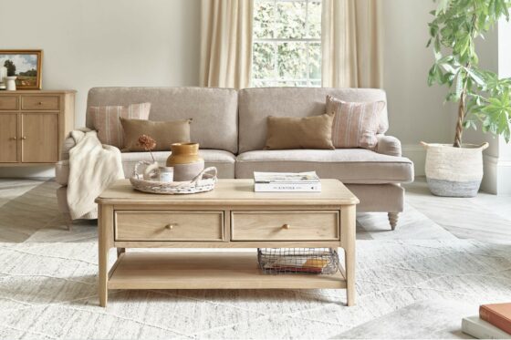 Front on view of the Newton coffee table in a neutral living room with the Stanmore sofa in cream fabric.
