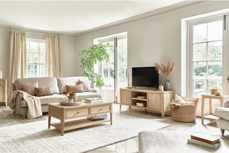 Elegant neutral living room featuring the Oak Furnitureland Stanmore cream sofa and pieces from the Newton range, including a TV unit and coffee table.