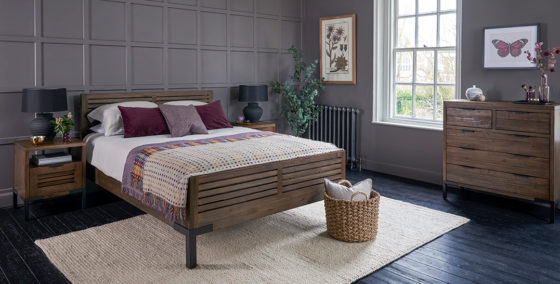industrial style bedroom with dark acacia wood furniture