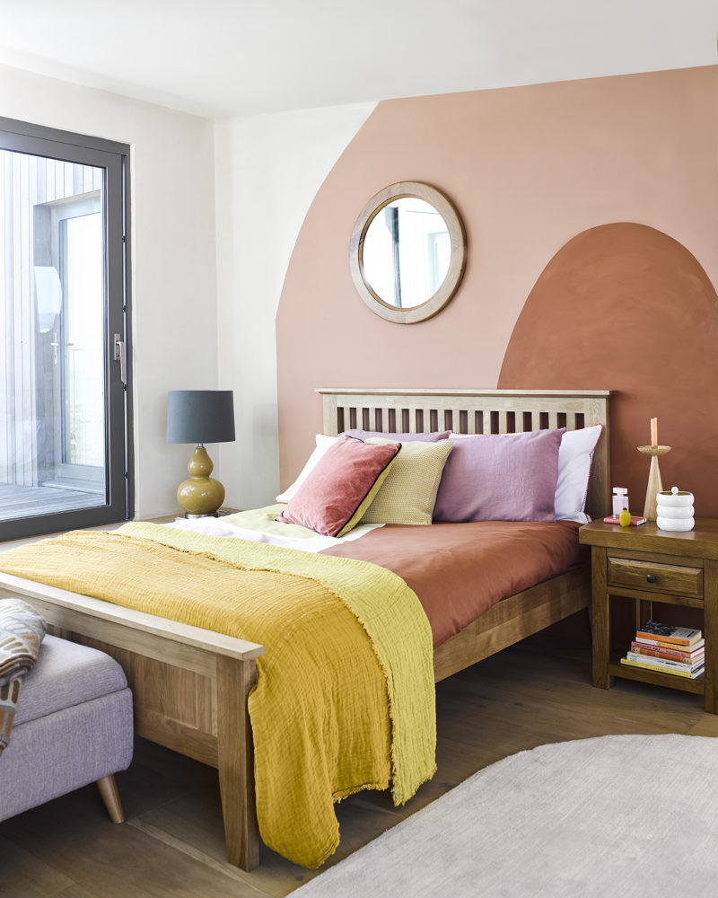 earth toned bedroom with curved painted walls