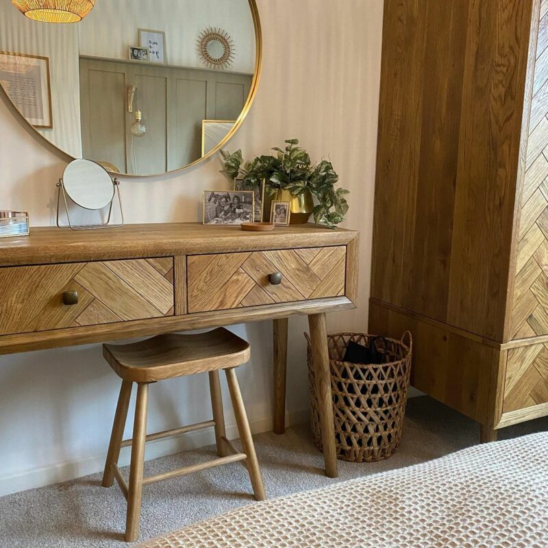 Parquet dressing table next to the matching wardrobe in a neutral bedroom scheme.