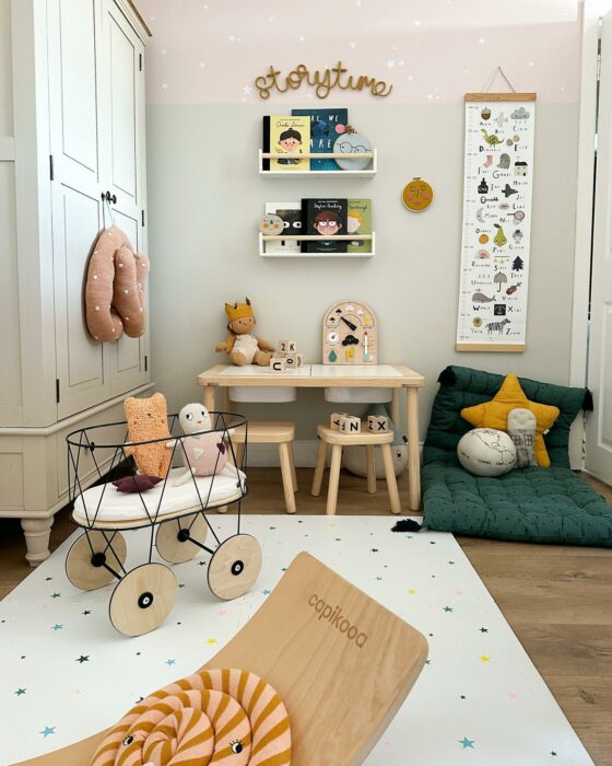 Playful children's bedroom with a pale wardrobe and colourful decorative touches.