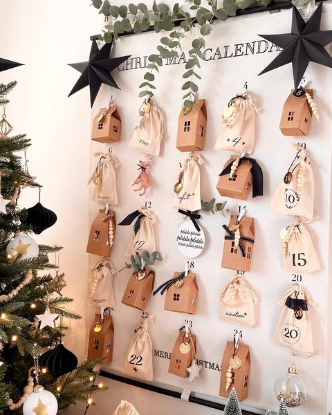 Hanging paper and fabric bag DIY advent calendar made by Katie Loves to Style.
