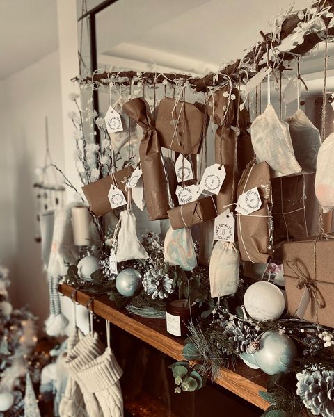 DIY advent nature-inspired advent calendar hanging above a mantlepiece. Made by Mummy to Kings.