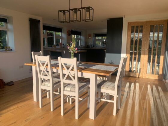 Oak Furnitureland St. Ives grey painted dining table in sun-lit kitchen/diner.