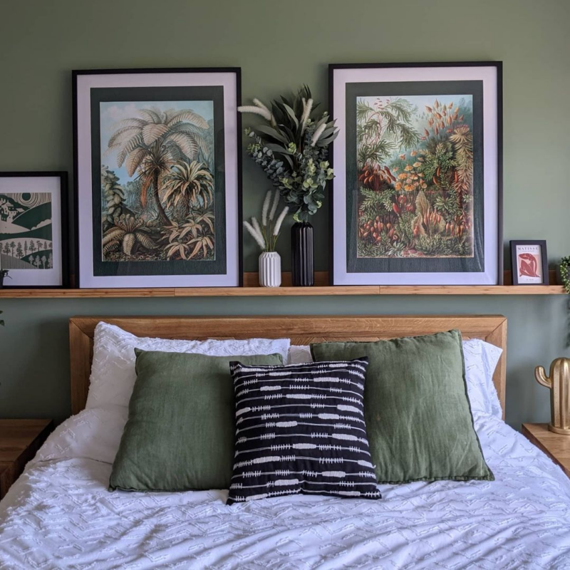 Green walls & botanical art pictured above Oak Furnitureland Parquet double bed with white bedding.