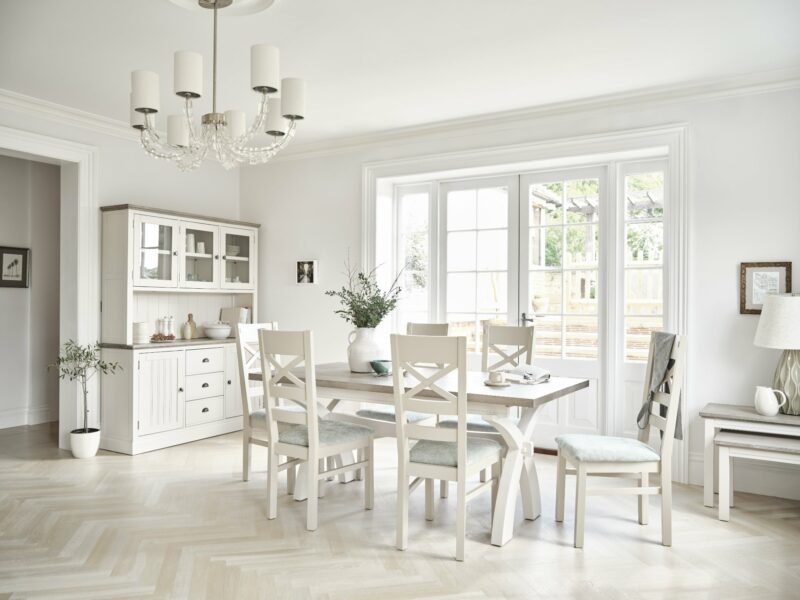 Brompton off-white painted range including a six-seater dining table and display cabinet in dining room.