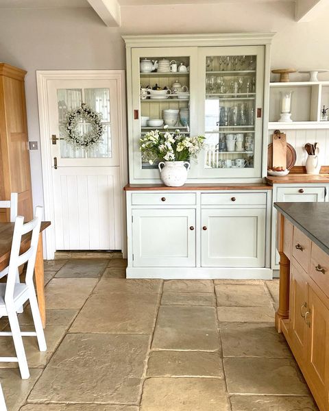 Laura Sunderland's farmhouse kitchen styed with flowers and greenery