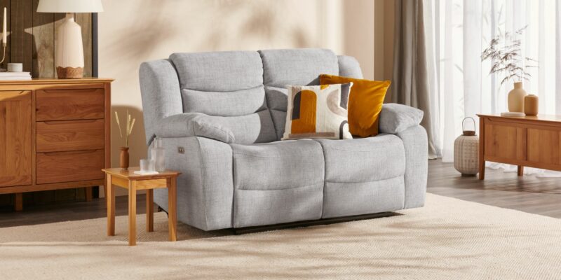 Grey Marlow electric recliner sofa in a living room with natural oak furniture.