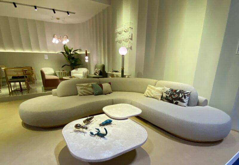 Curved grey sofa and curved grey table at Maison & Objet trade fair.