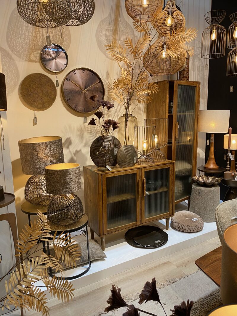 Wooden furniture and rattan details on display at Maison & Objet trade fair in Paris.