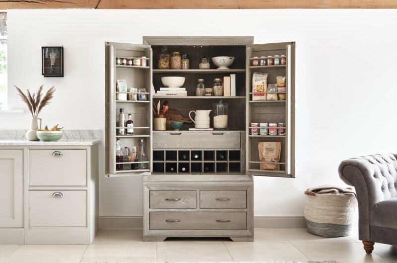 Oak Furnitureland grey wash Willow larder open with organised kitchen essentials and storecupboard items.