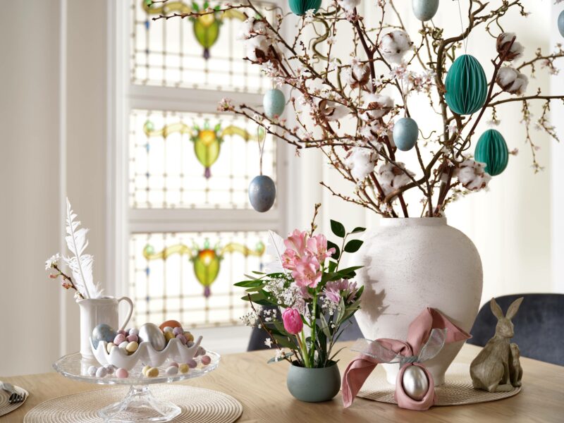Tablescape with decorated Easter tree and accessories