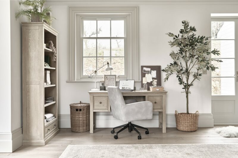 Oak Furnitureland Burleigh weathered oak home office range in a space styled with houseplants and natural accessories.