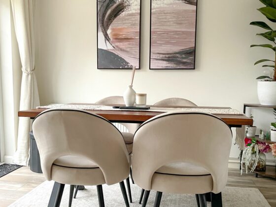 Neutral dining room with Oak Furnitureland Farne wall art in pink, blue and grey colour palette.