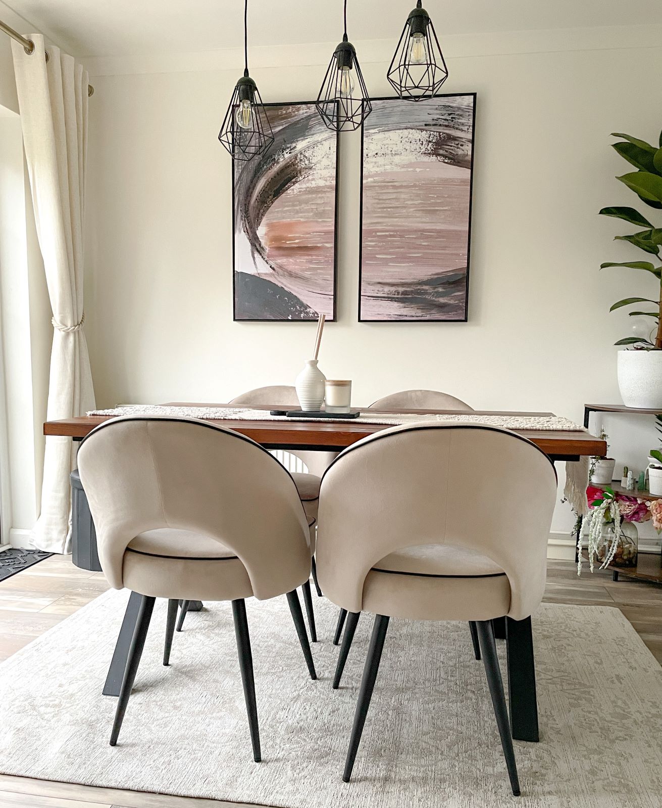 Neutral dining room with Oak Furnitureland Farne wall art in pink, blue and grey colour palette.