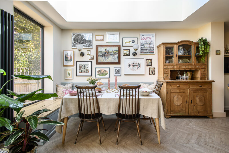 Beautiful eclectic dining room with a dining table, gallery wall and Welsh dresser.