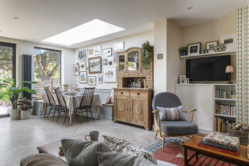 Kitchen dining space with hidden bench storage seating and vintage furniture.