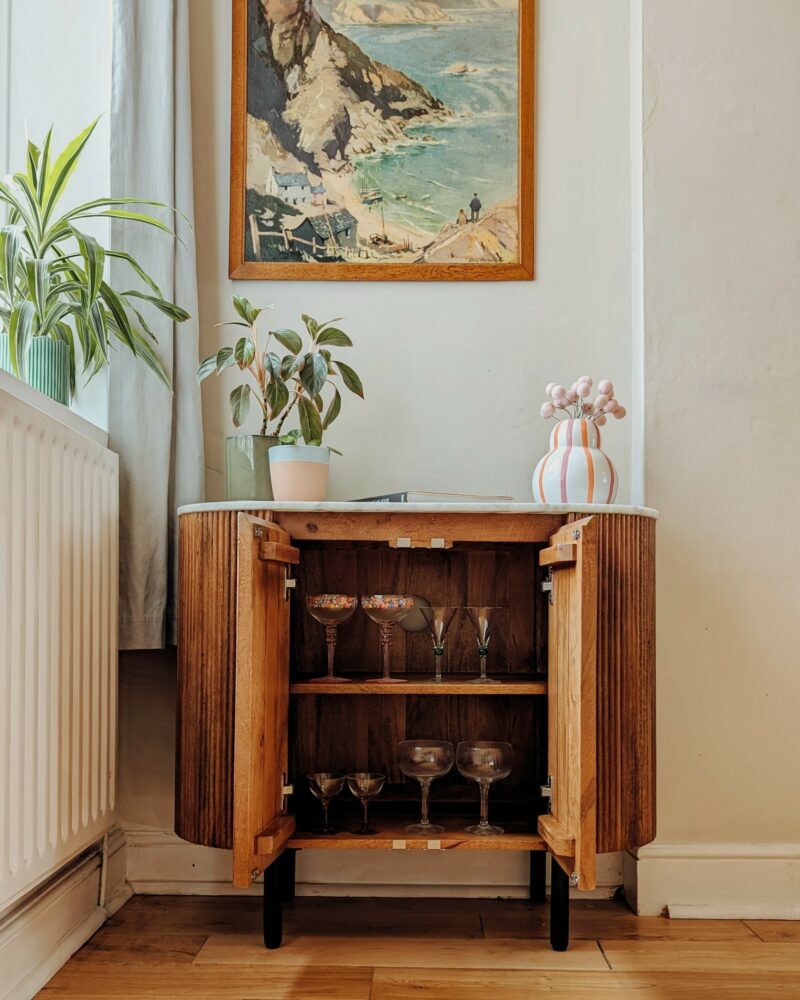 A sideboard-living room furniture-small wooden sideboard-vintage glassware-houseplants