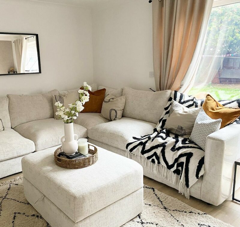 A corner sofa and footstool-living room furniture-cream corner sofa with matching storage footstool