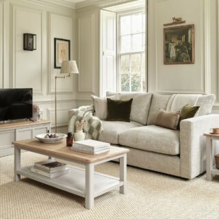 A sofa, coffee table and TV unit-living room furniture-painted wooden coffee table-sliding door wooden TV unit-beige sofa-framed artwork-wall panelling